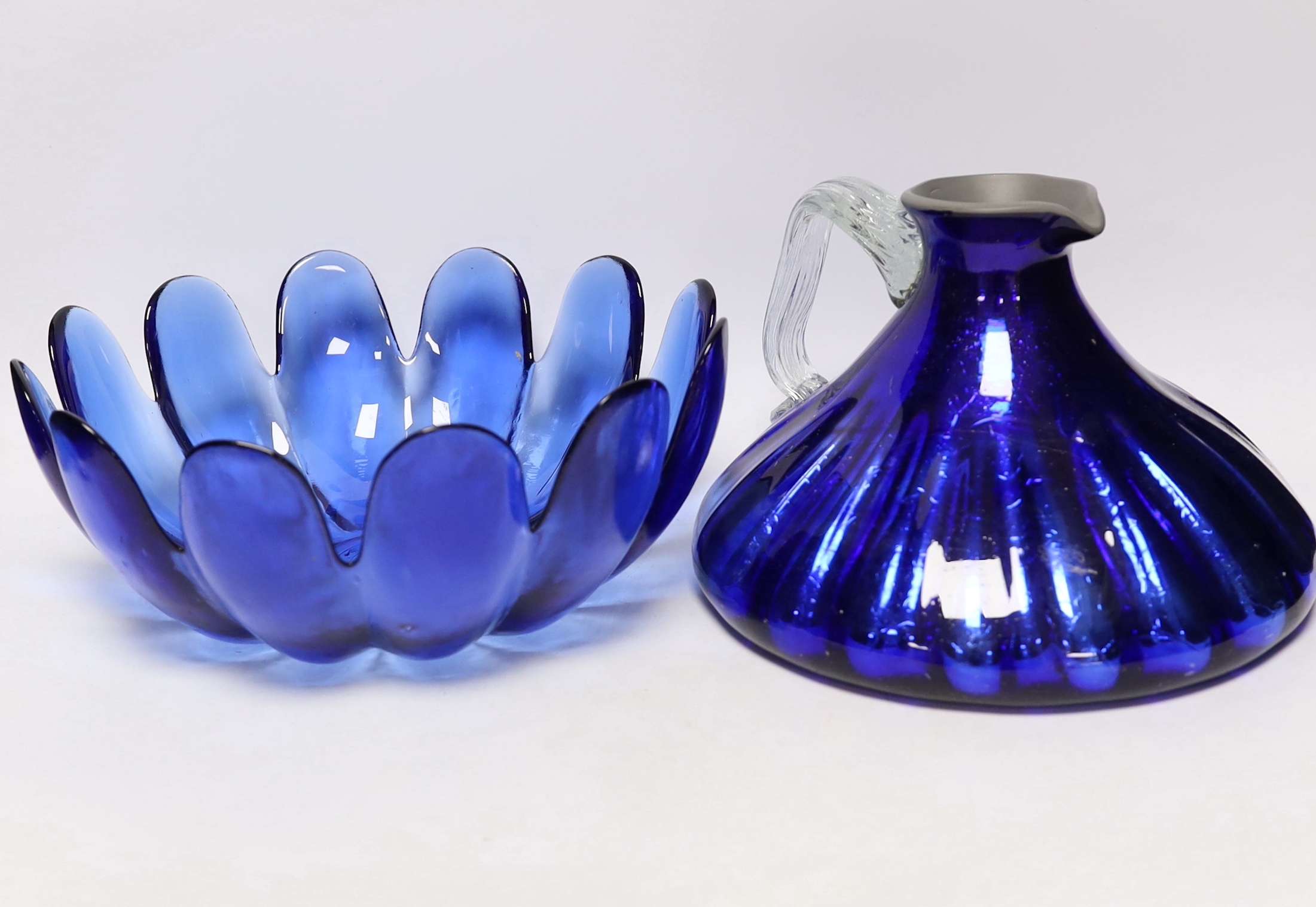 A group of glassware including Small Tiffany vase, two Baccarat dishes and a large blue glass fruit bowl, largest 28cm in diameter